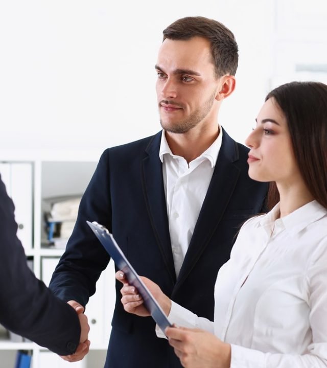 Escort service interpreter works with the transaction accompanies documents conclusion of the contract important situation. Arab businessman and his translator welcome business partner and says hello S